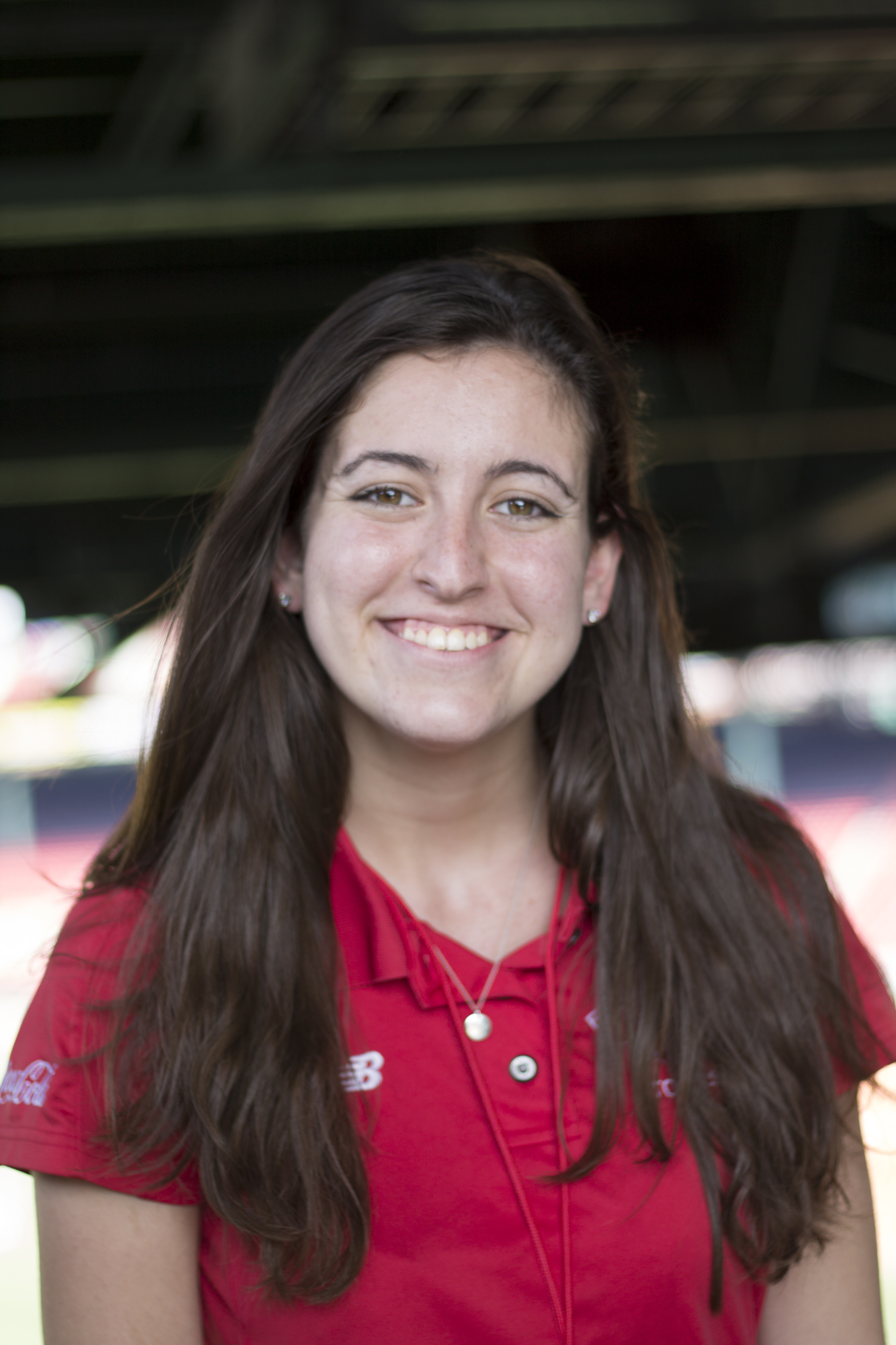 A young white woman smiles at the camera.