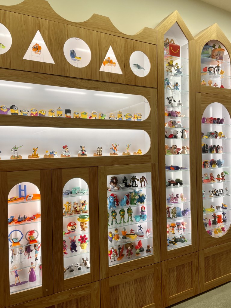A display of Happy Meal toys from throughout the years.
